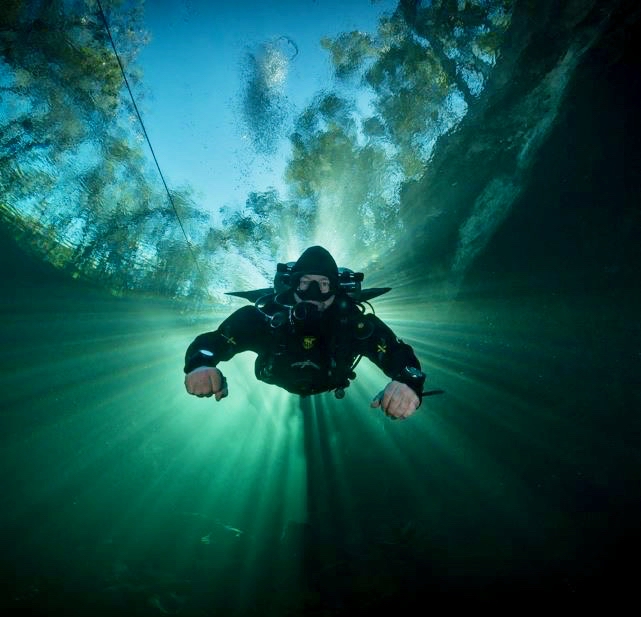 Scuba Exotique Dive Training Center - Diver going through halocline in the Cenotes